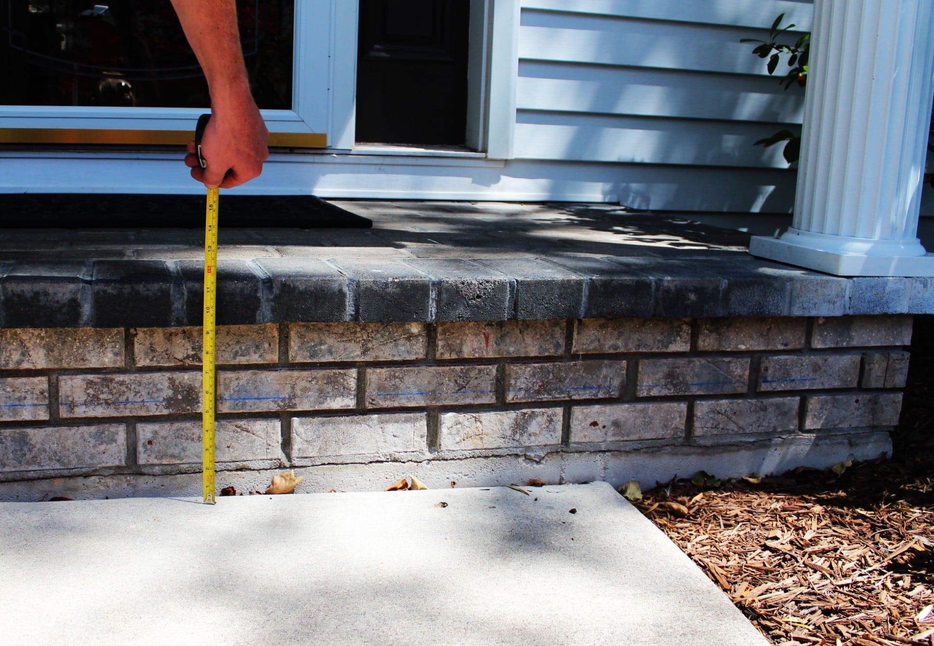 Tape measure showing how far a concrete slab had settled